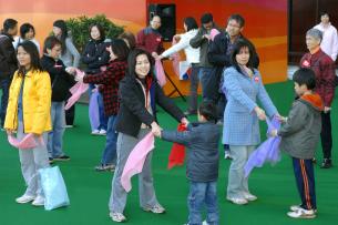 Hong Kong Gymnastics Association coaches demonstrating healthy exercises to encourage fitness among members and their families
