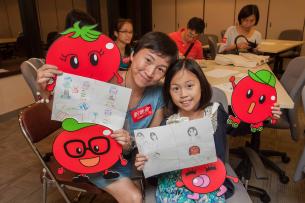 Members at the Loving Homes Support the Family Comic Workshop draw personalized cartoons