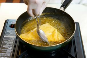 Dip the crêpes in the sauce mixture for about a minute until they are steeped and prepare to serve