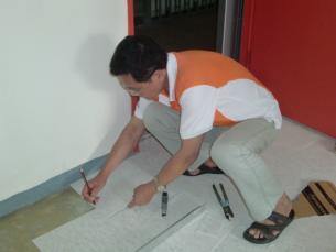 SHKP volunteer doing basic decoration for the needy
