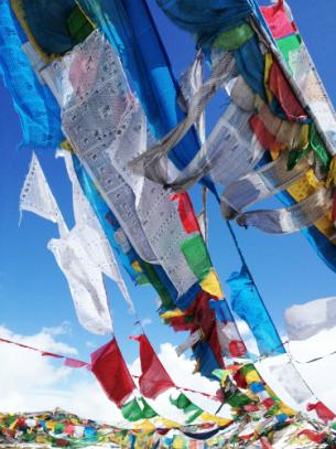 Colourful prayer flags with scripture fluttering in the wind