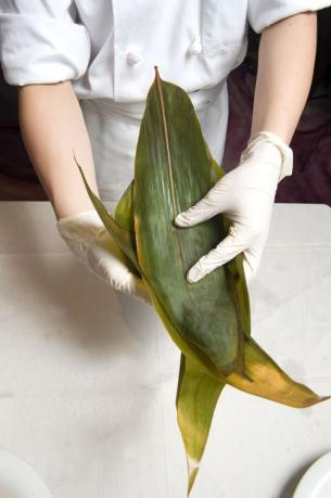 Chef demonstration: Cover with bamboo leaves and wrap into a dumpling